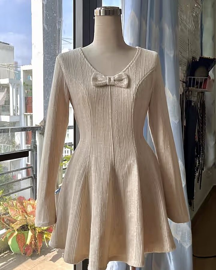 Beige angora-knit dress with bow