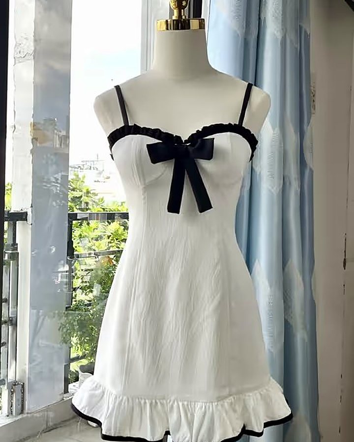 White mini dress with black bow